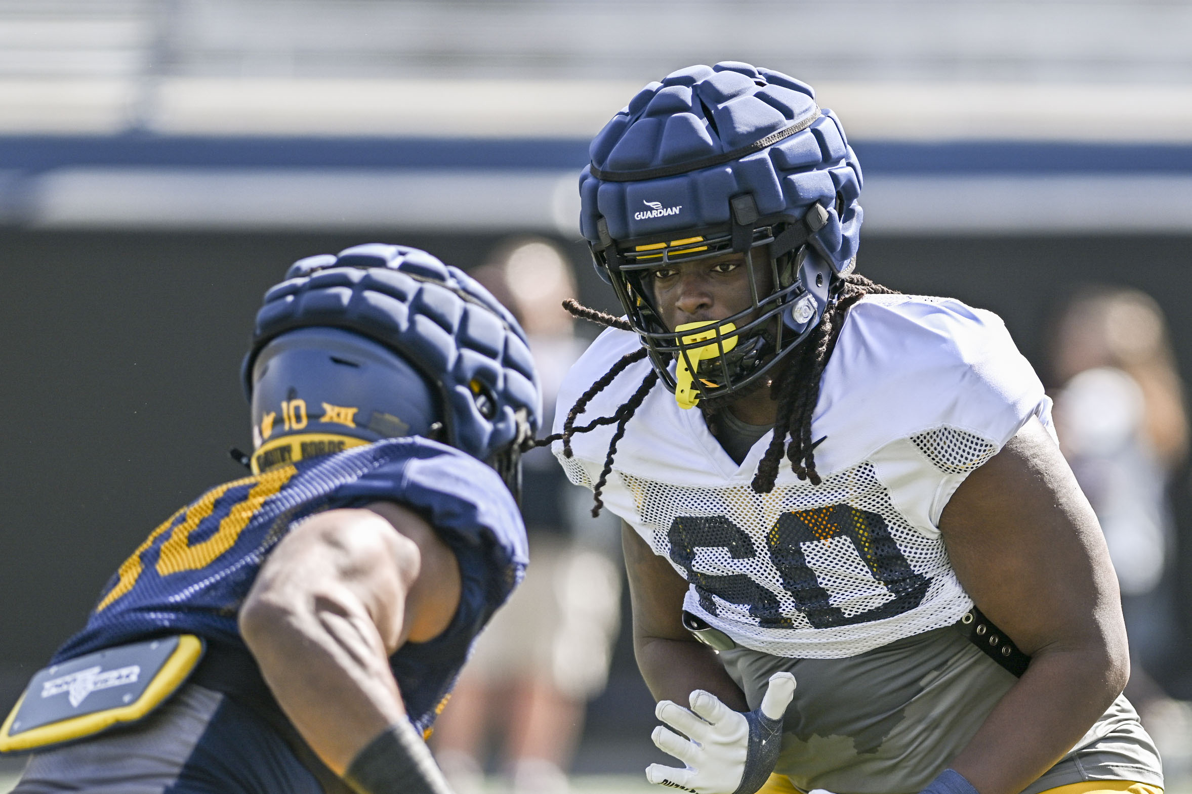 WVU is cross-training linemen this spring to improve depth, football IQ